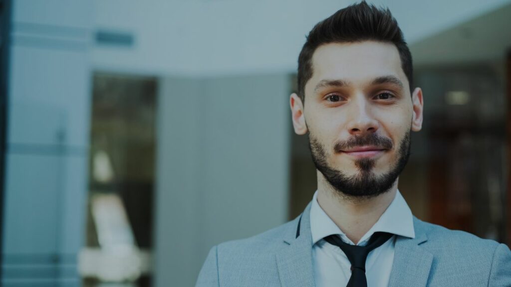 Portrait of a confident business professional in a modern office setting.